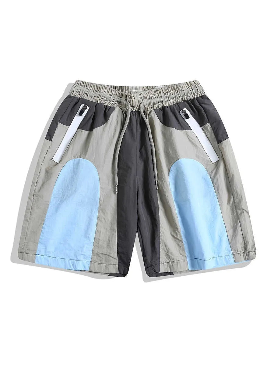 Blue patchwork men's sports shorts with loose straight-leg cut and elastic waist