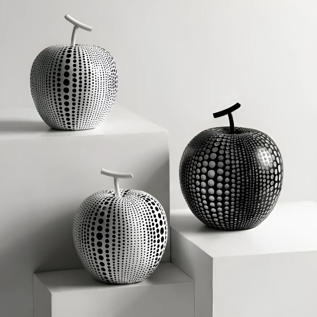 Resin decorative crafts set showing high black apple and low white pear sculptures