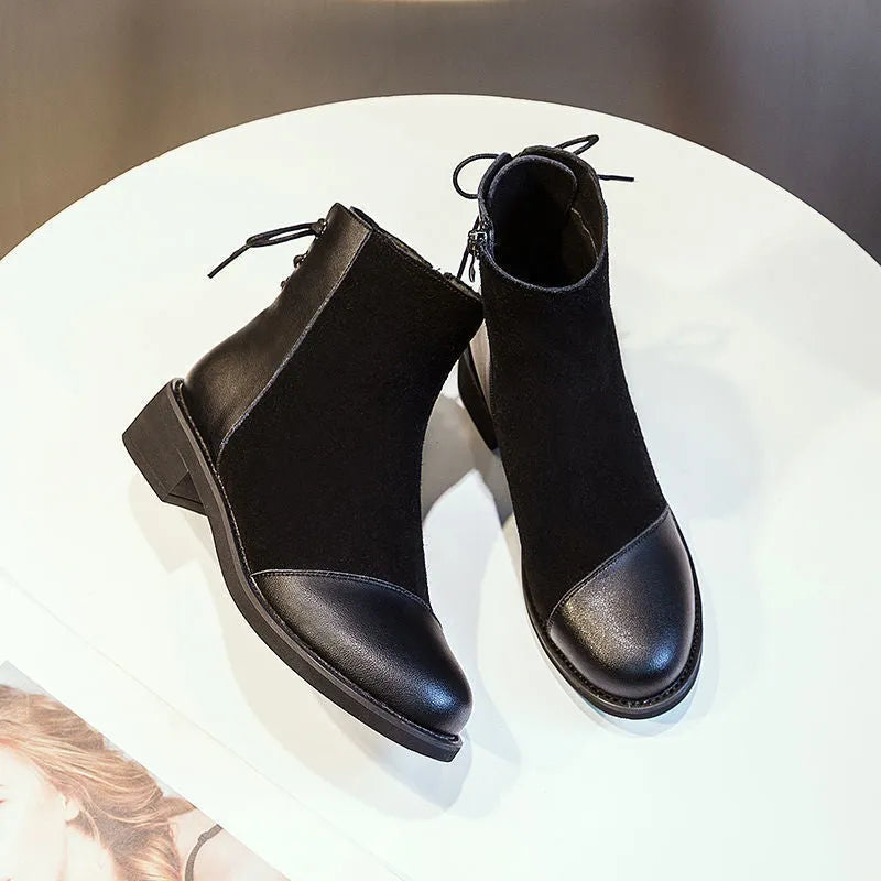 Black women's over-the-knee Martin boots with side zipper and decorative bow.