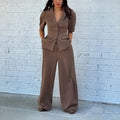 Brown men's polyester slim fit suit with trousers on a hanger