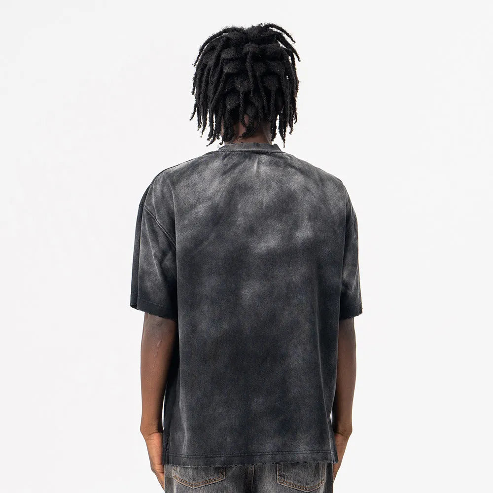 Black men's loose-fit cotton t-shirt with a printed letter design and drop-shoulder short sleeves.