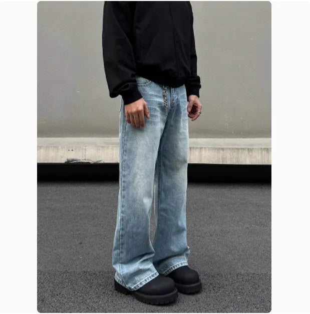 Men's blue straight leg jeans with whisker wash detailing and visible stitching on medium-high waist