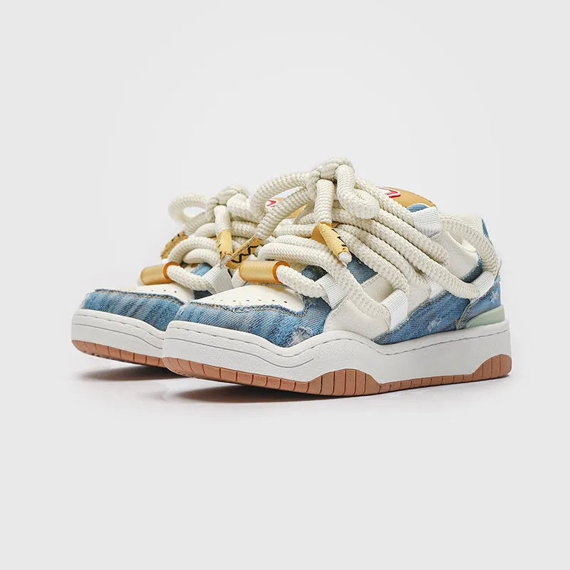 Pair of thick-soled casual lace-up shoes in a solid colour on a white background.