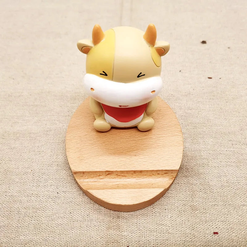 Resin mobile phone holder with beech wood animal design and coin storage compartment