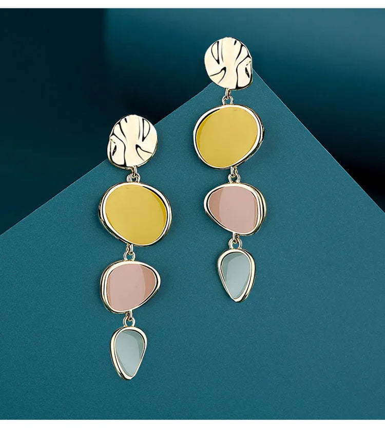 Pair of simple alloy disc earrings with a Morandi three-colour oil drip finish and sterling silver posts.
