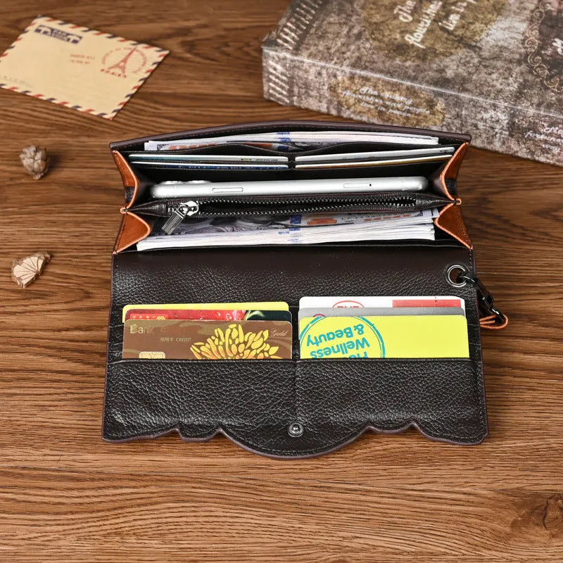 Women's brown tri-fold leather wallet with embossed Chinese floral pattern showing multiple compartments