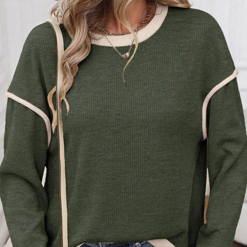 Loose drop shoulder knit top with four leaf clover contrast trim at collar and sleeves