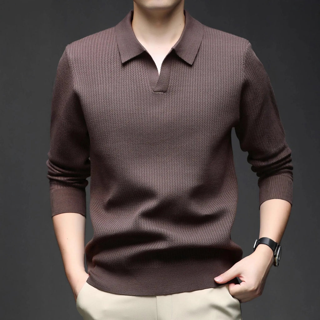 Man wearing a loose-fit green casual pullover sweater for autumn leisure.