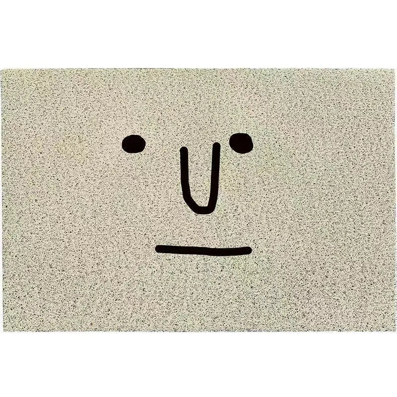Mr. Big Nose cartoon facial expression PVC floor mat with geometric pattern in a square shape on a home floor.