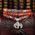 Watermelon crystal bracelet with Chinese knot detailing in geometric national style design