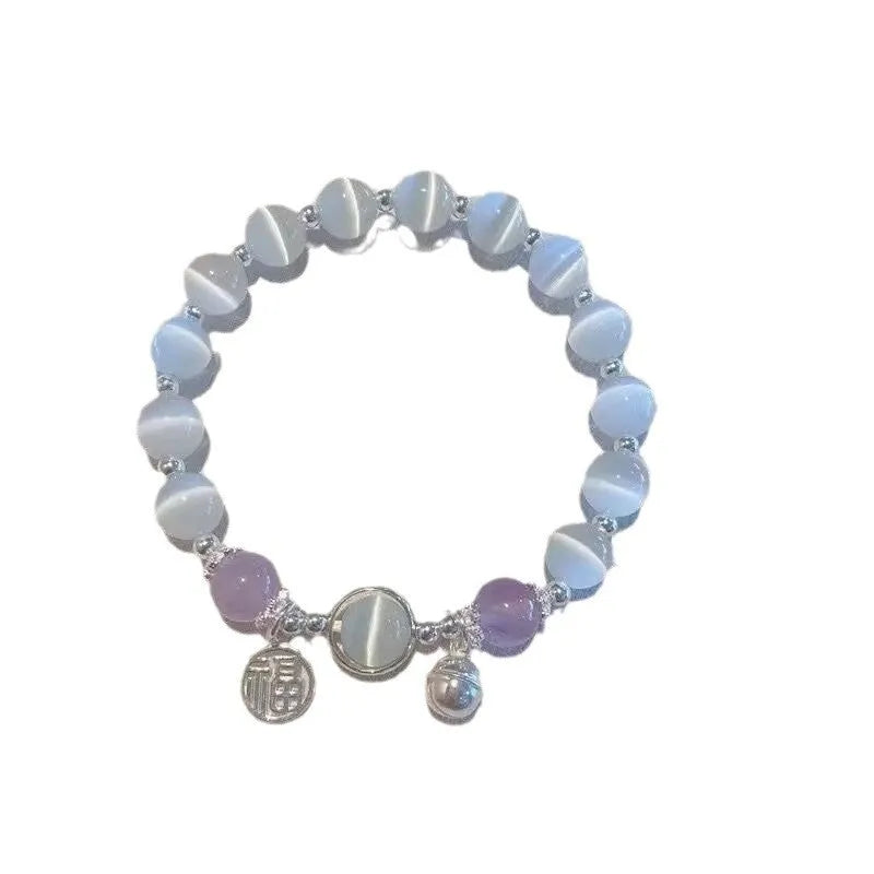 Handmade glass butterfly charm bracelet for women in a drop shape with round details.