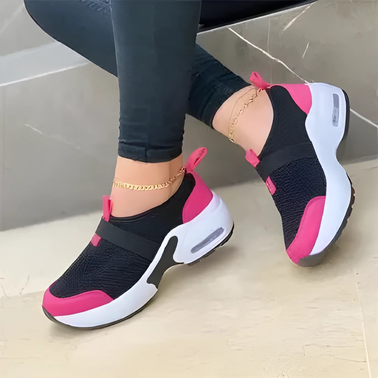 Women's flat mesh sneakers in light grey with white rubber soles and colour stitching.