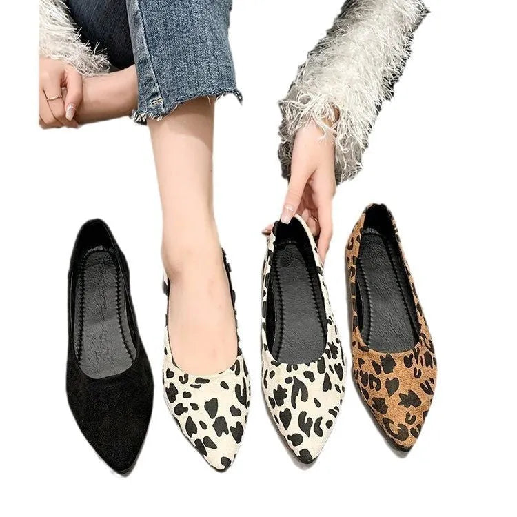 Women's leopard print flat pumps with pointed toe and low heel on rubber sole