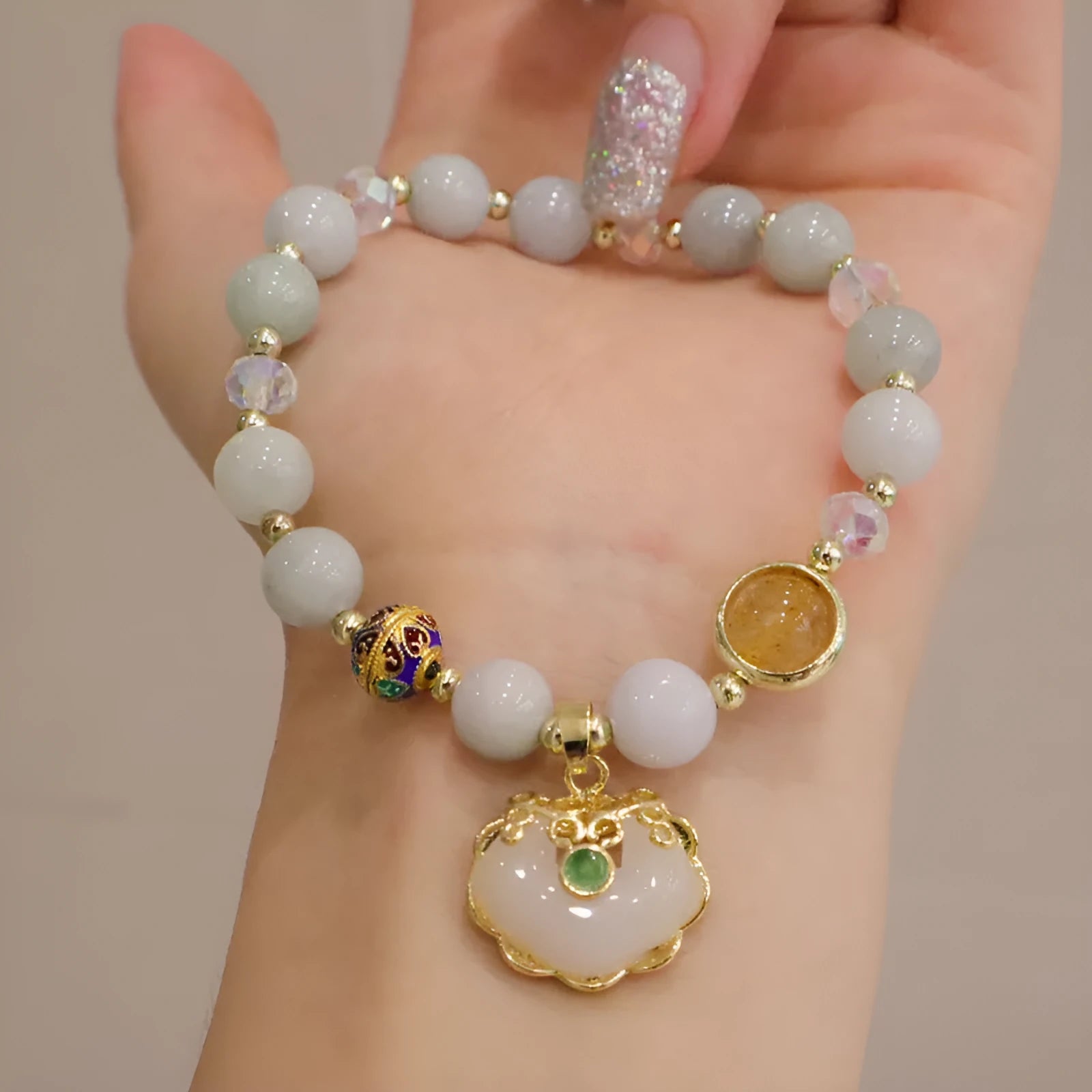 Geometric ethnic style jade bracelet with three-dimensional metal decorations in grey jade or strawberry quartz