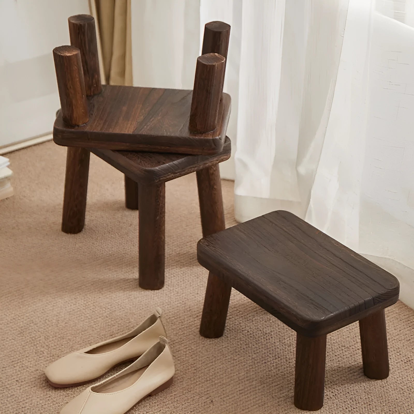 Solid wood shoes changing stool with distressed finish and bracket leg structure.