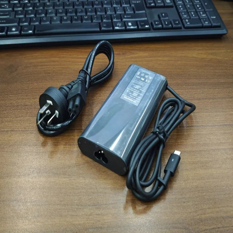Black 65W USB Type-C laptop power adapter with international plug options