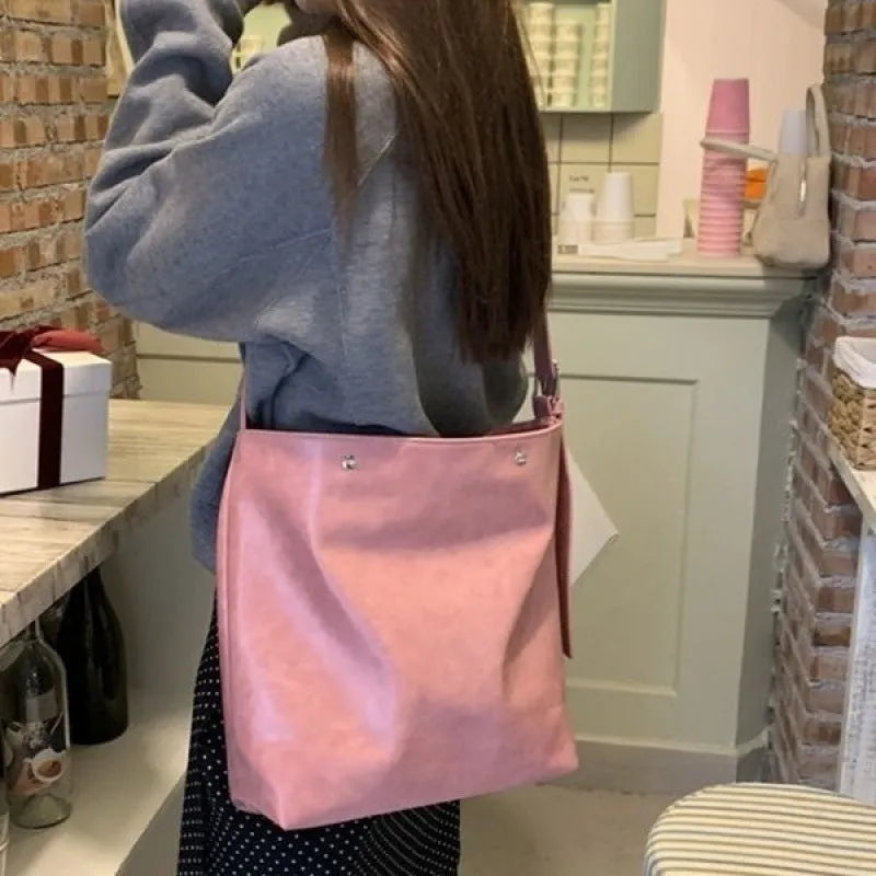 Corduroy one-shoulder commuter bag in pink with PU-lined interior