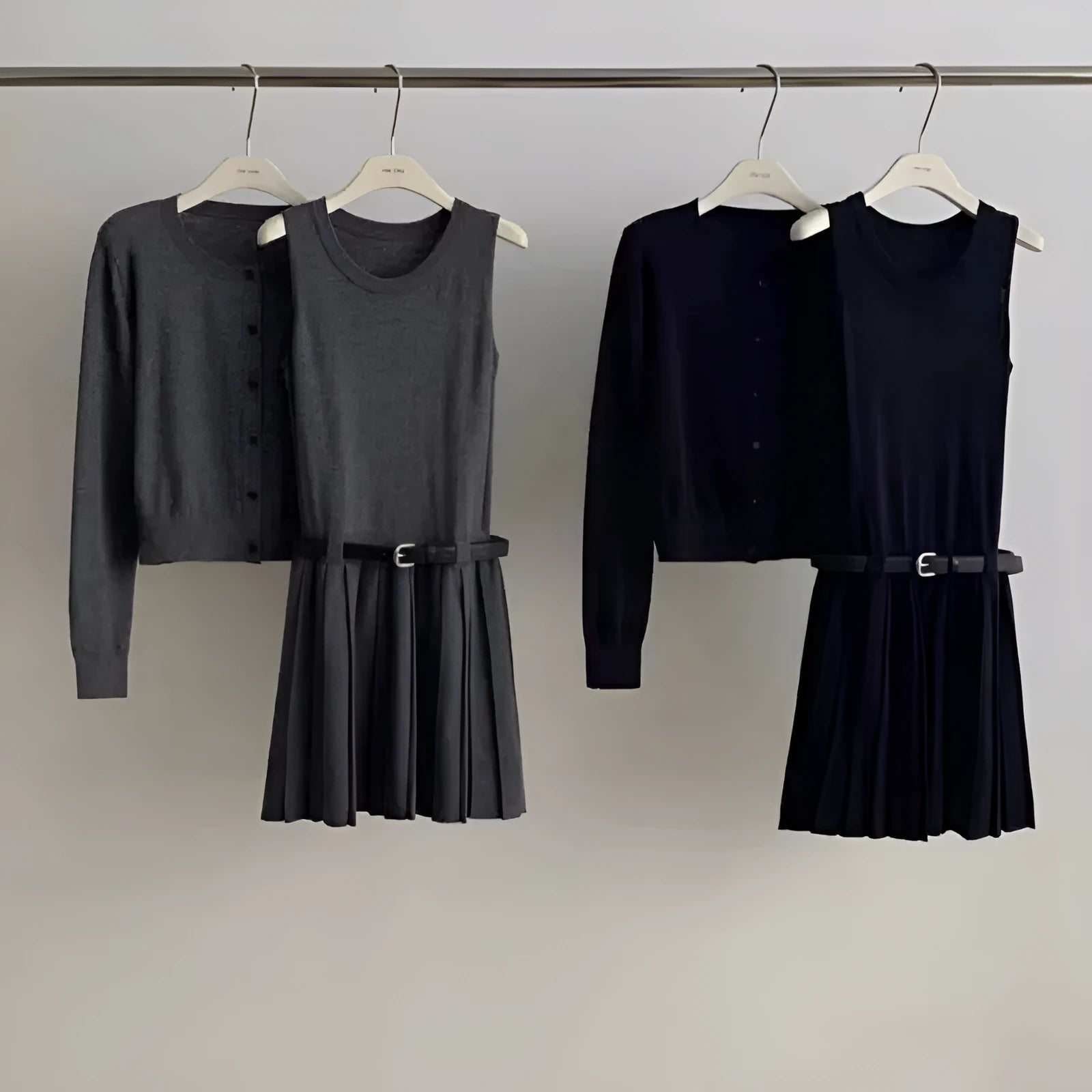 Women's grey vest skirt and cardigan two-piece set with belt and pleated details