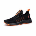 Men's black casual sports shoes with cross-strap detail and Flying Weave textured upper.