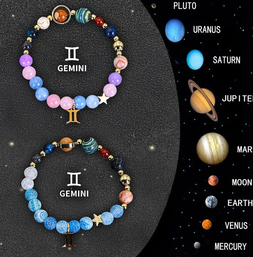 Set of two natural stone beaded bracelets with zodiac sign charms on a white background.