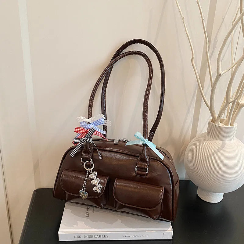 Retro pillow-shaped women's handbag in PU leather with double shoulder strap