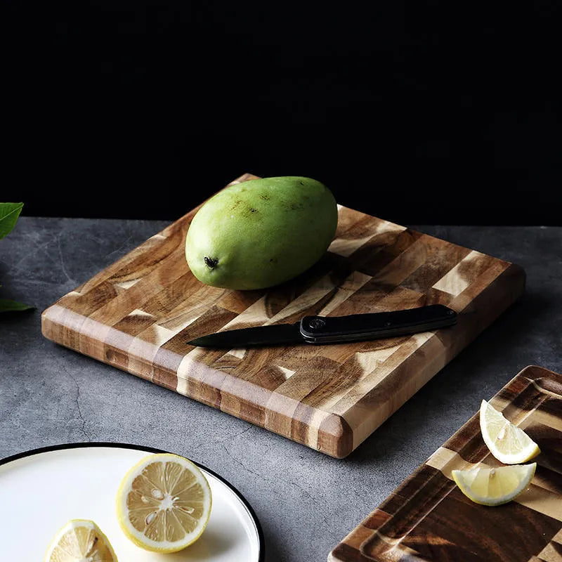 Brown imported acacia solid wood cutting board with 3cm thickness on kitchen counter