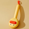 Yellow and white pet grooming comb with duck design and needle teeth for cats and dogs.