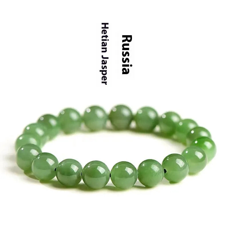 Polished Hetian jade jasper ball bracelet showing natural stone beads in multiple size options on a wrist.