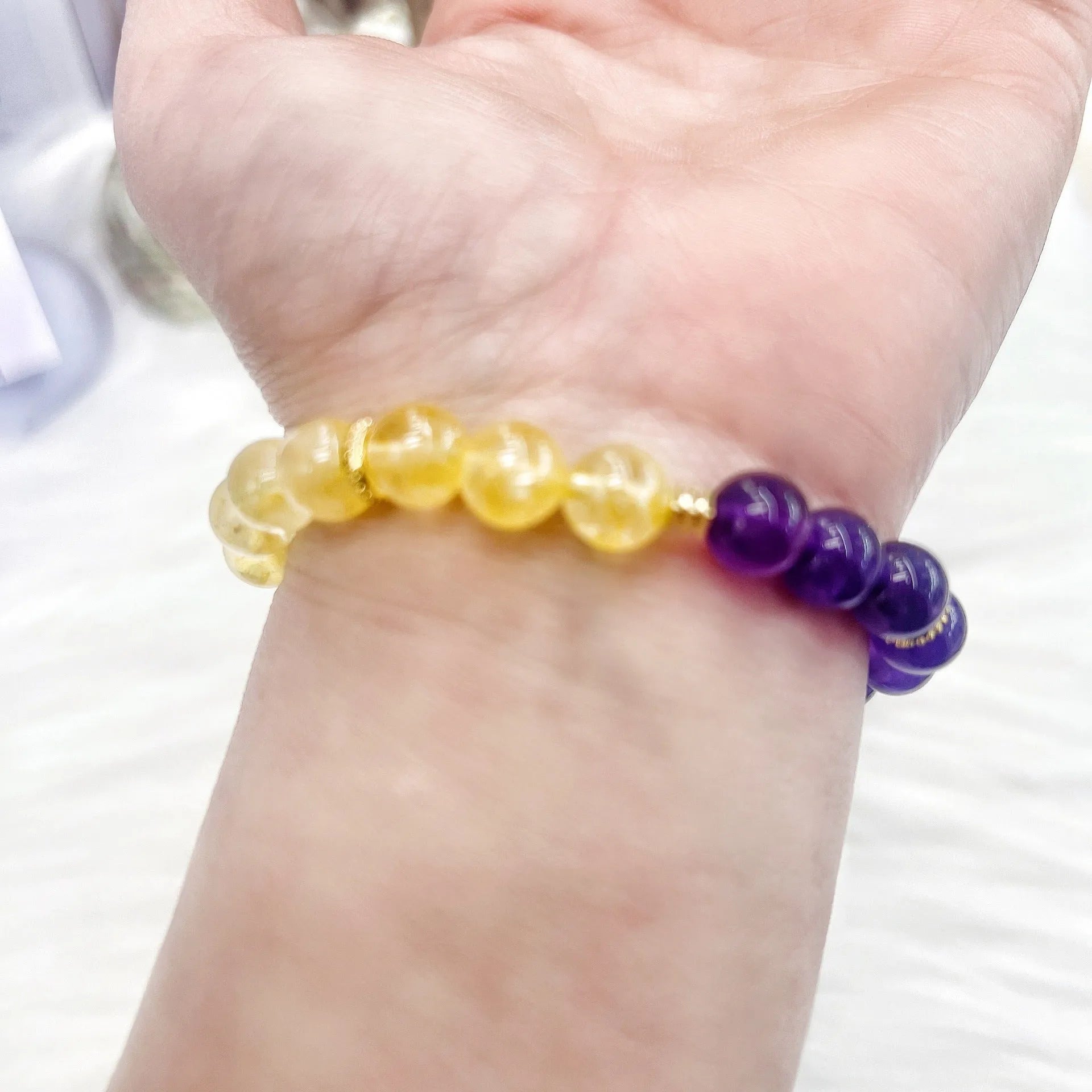 Handmade women's amethyst crystal bracelet with yellow and purple stones