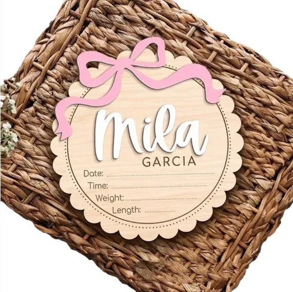 Square wooden baby room ornament with a custom engraved name, shown in two size options.