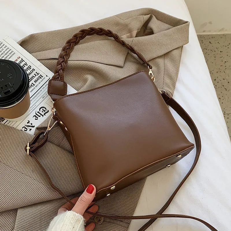 Retro woven PU leather unisex crossbody bucket bag in khaki colour.