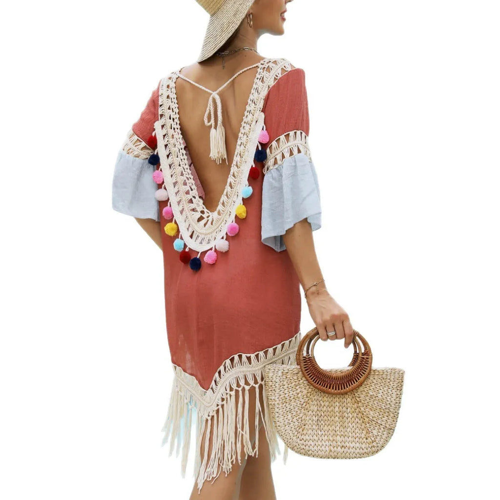 Orange floral pattern beach overskirt with hand crochet stitching and tassel hem detail