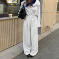 White striped wide-leg women's trousers with front zipper in loose casual fit