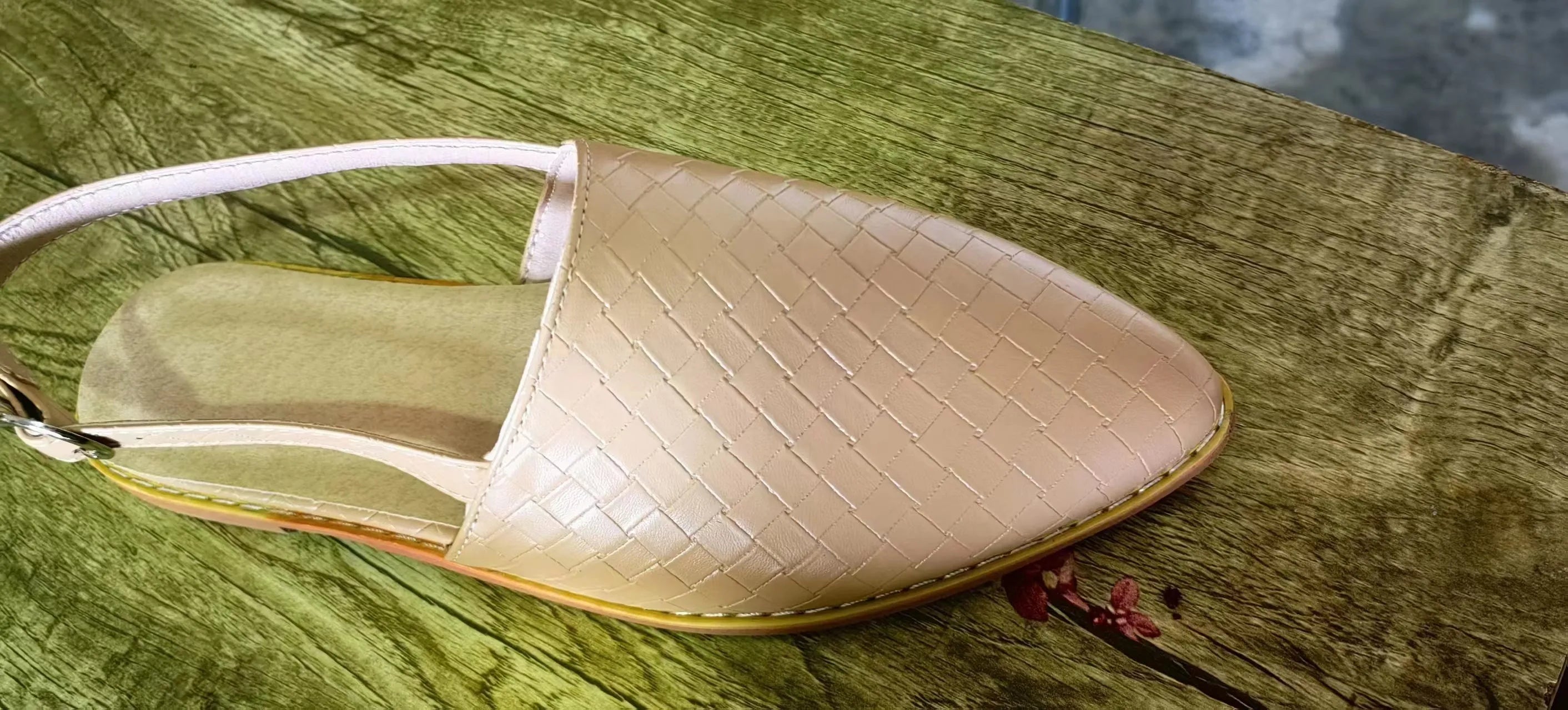Baotou flat sandals with a buckle strap and pointed toe, shown in one of six available colours.