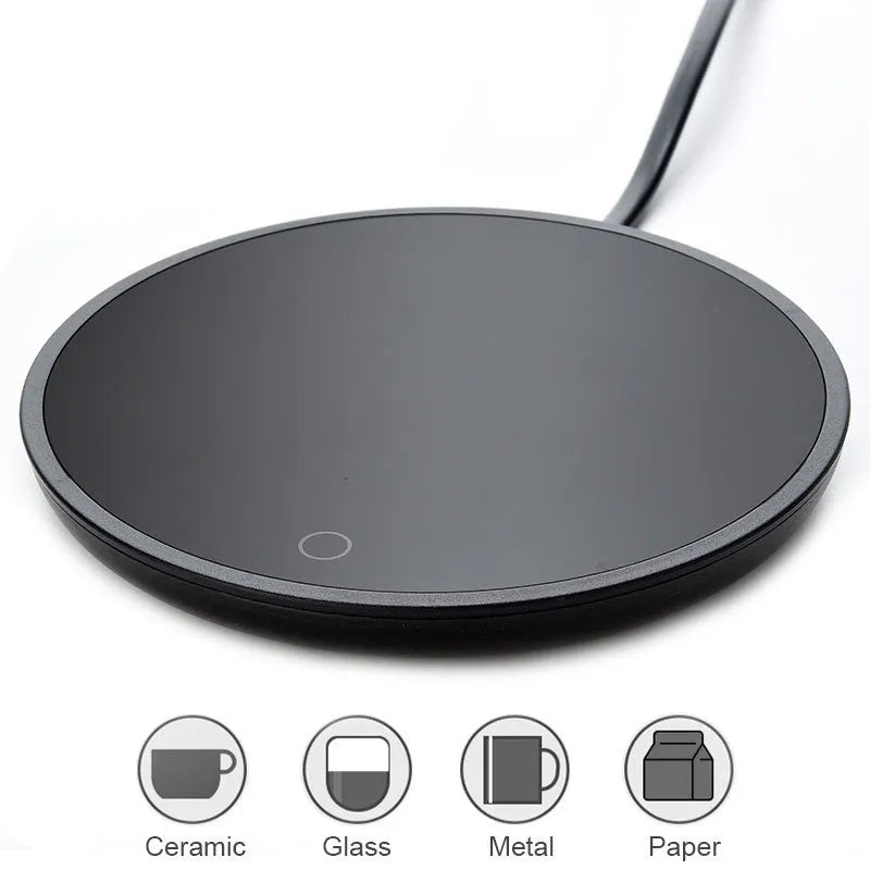 Black coffee mug warmer on a desk with low and high temperature switch