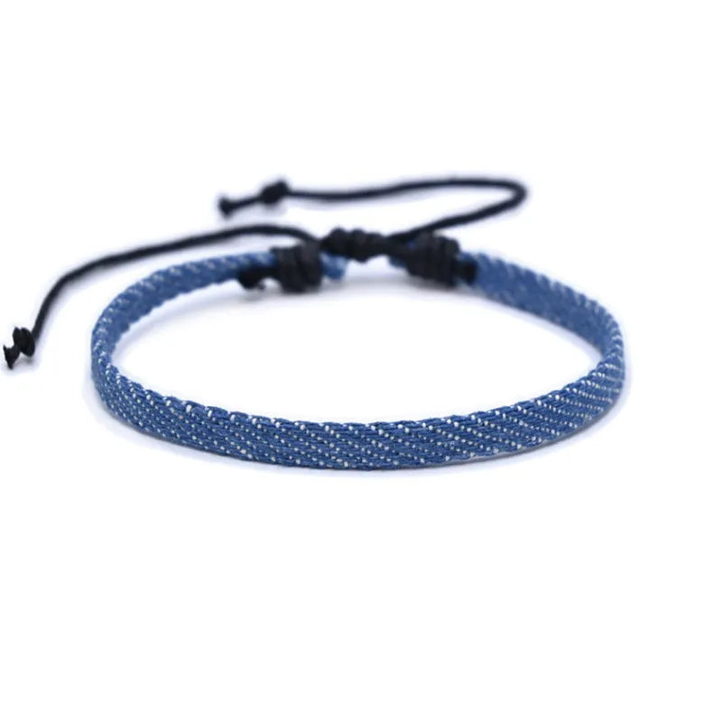 Denim fabric bracelet carrying strap in unisex design with mixed materials and cute styling