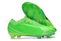 Men's black football shoes with FG studs, knitted upper, and lace-up closure on grass pitch