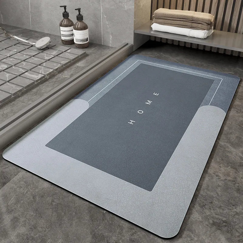 Soft blue oval bathroom floor mat placed on tiles beside a bathtub.