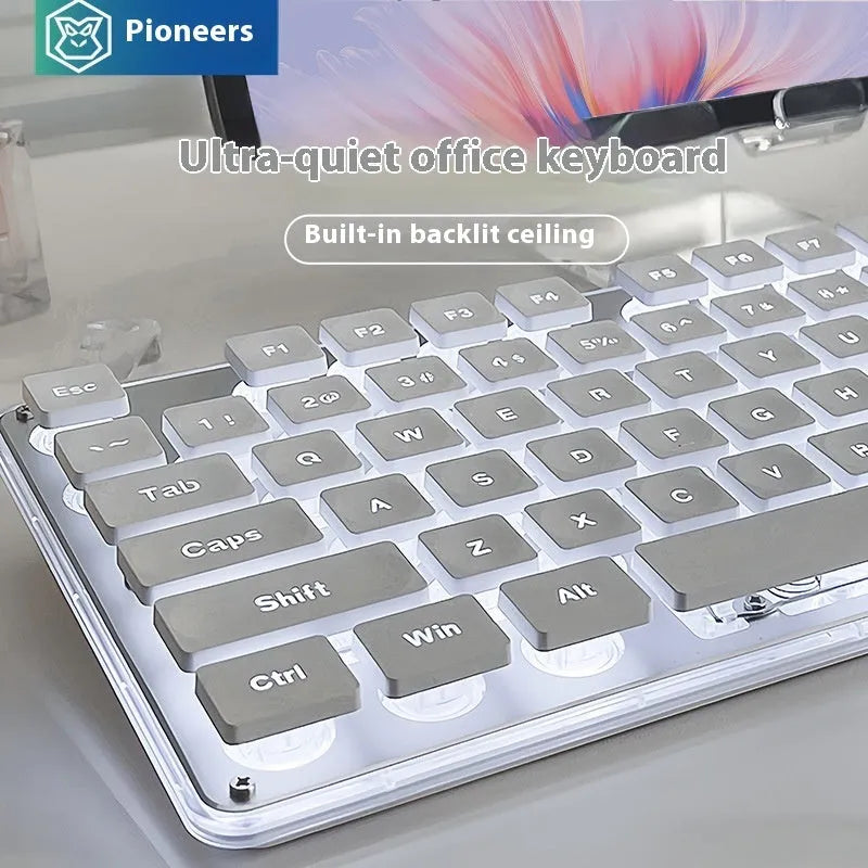 Wired computer keyboard with mute button and blue backlighting on a desk