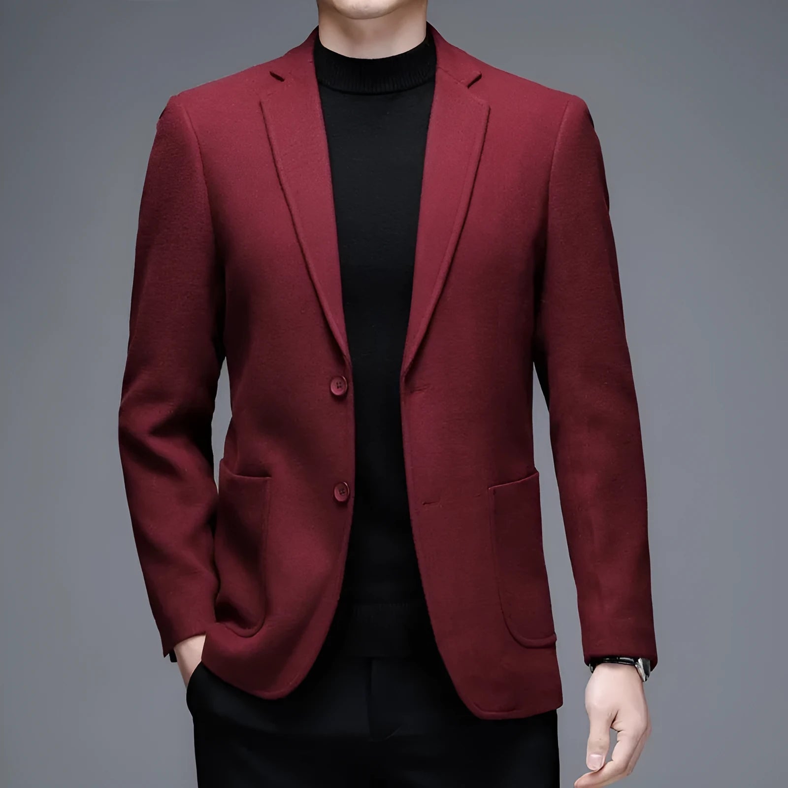 Men's loose fit wool suit jacket in solid colour showing round hem design and long sleeves