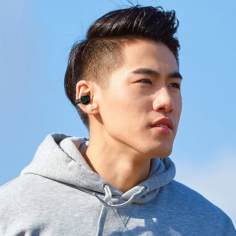 Black wireless Bluetooth headset with clip-on design and bone conduction technology