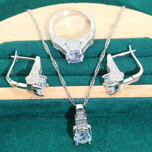 Bridal zircon four-piece jewellery set with necklace, earrings, bracelet, and ring in water wave chain style.