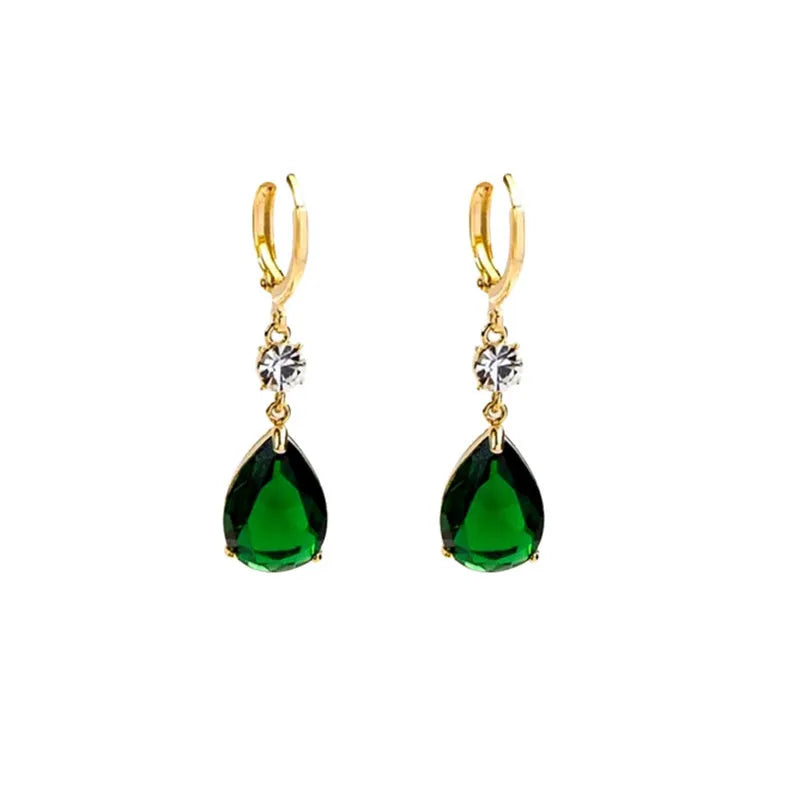 A pair of green geometric teardrop-shaped alloy earrings on a white background.