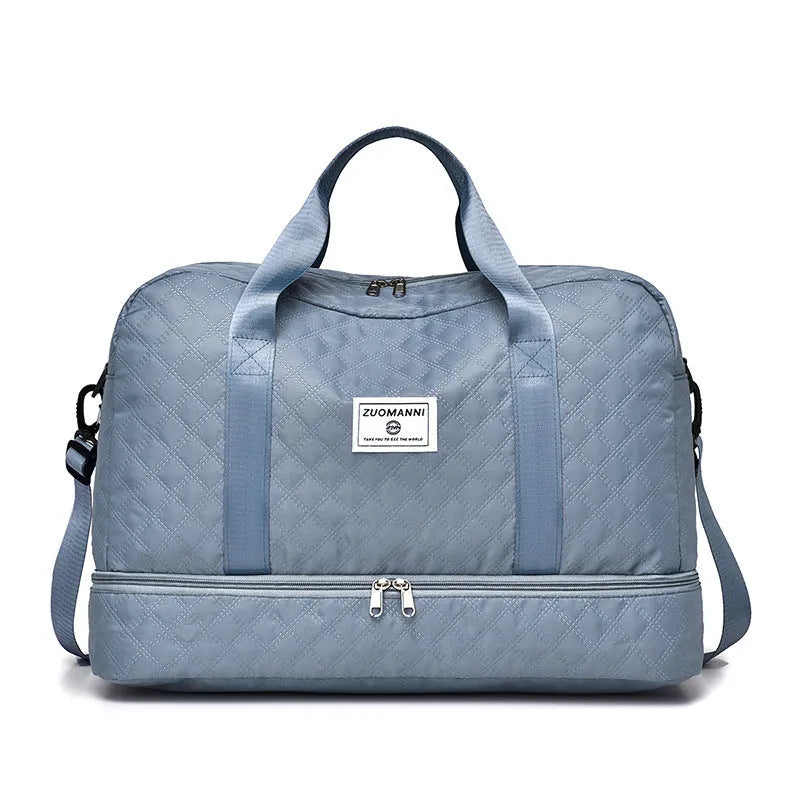 Large Oxford cloth travel bag with 36-55 litre capacity shown in haze blue colour