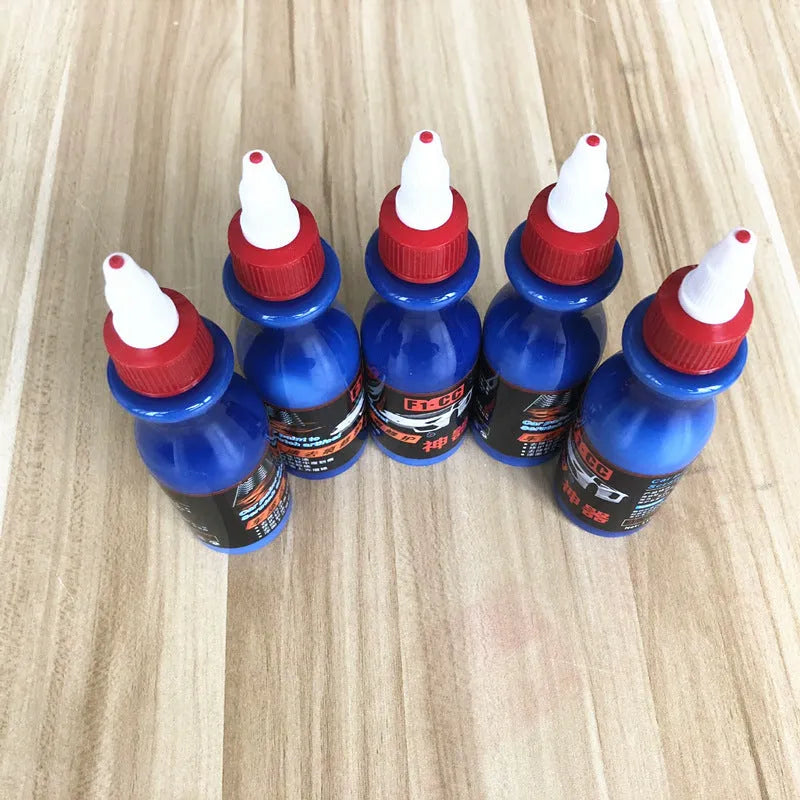 Small blue car wiping tool kit with scratch repair agent bottle and applicator sponge.