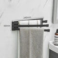 Nordic-style folding towel rack in black or white with adhesive mounting system