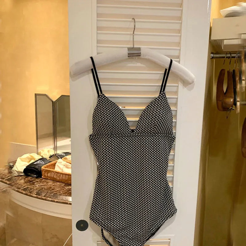 Blue and black one-piece swimsuit for small chest coverage with polyester fabric