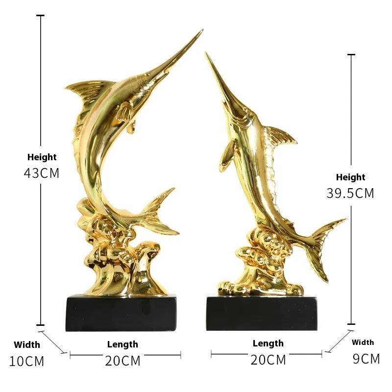 Close-up of a detailed resin European swordfish ornament in bright gold colour on a shelf.