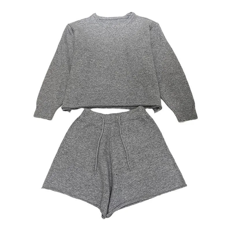Women's loose grey knitted sweater and wide leg shorts two-piece loungewear set.