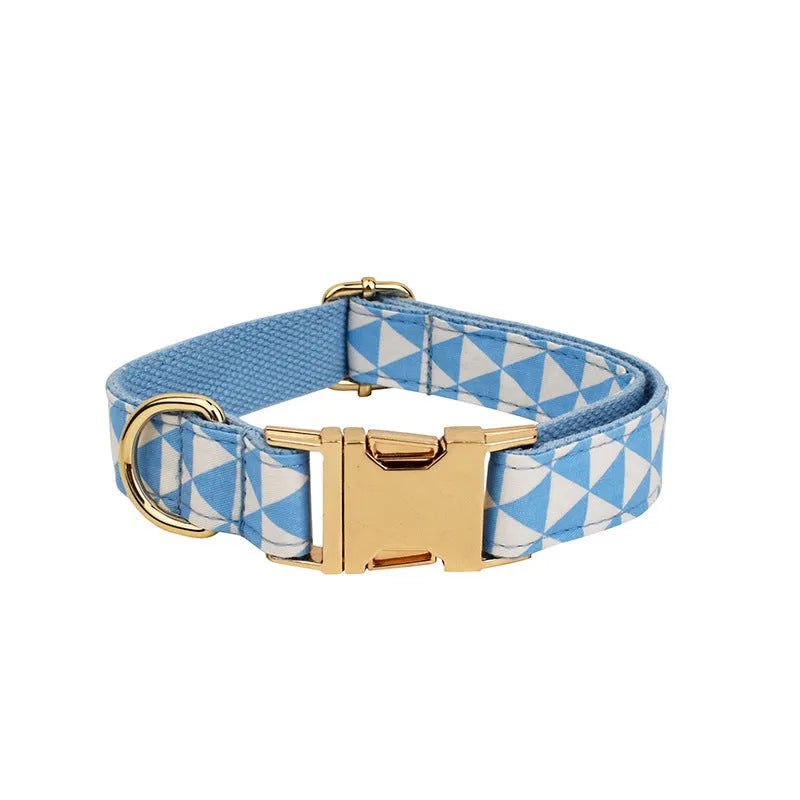 Blue cloth dog accessory set showing vest, collar, leash, and bow for small to medium breeds